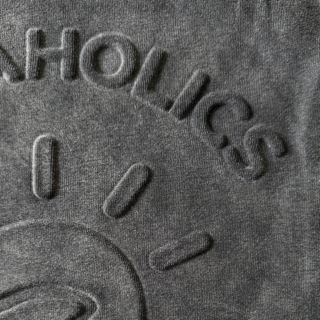Aquaholics black hoodie embossed logo detail