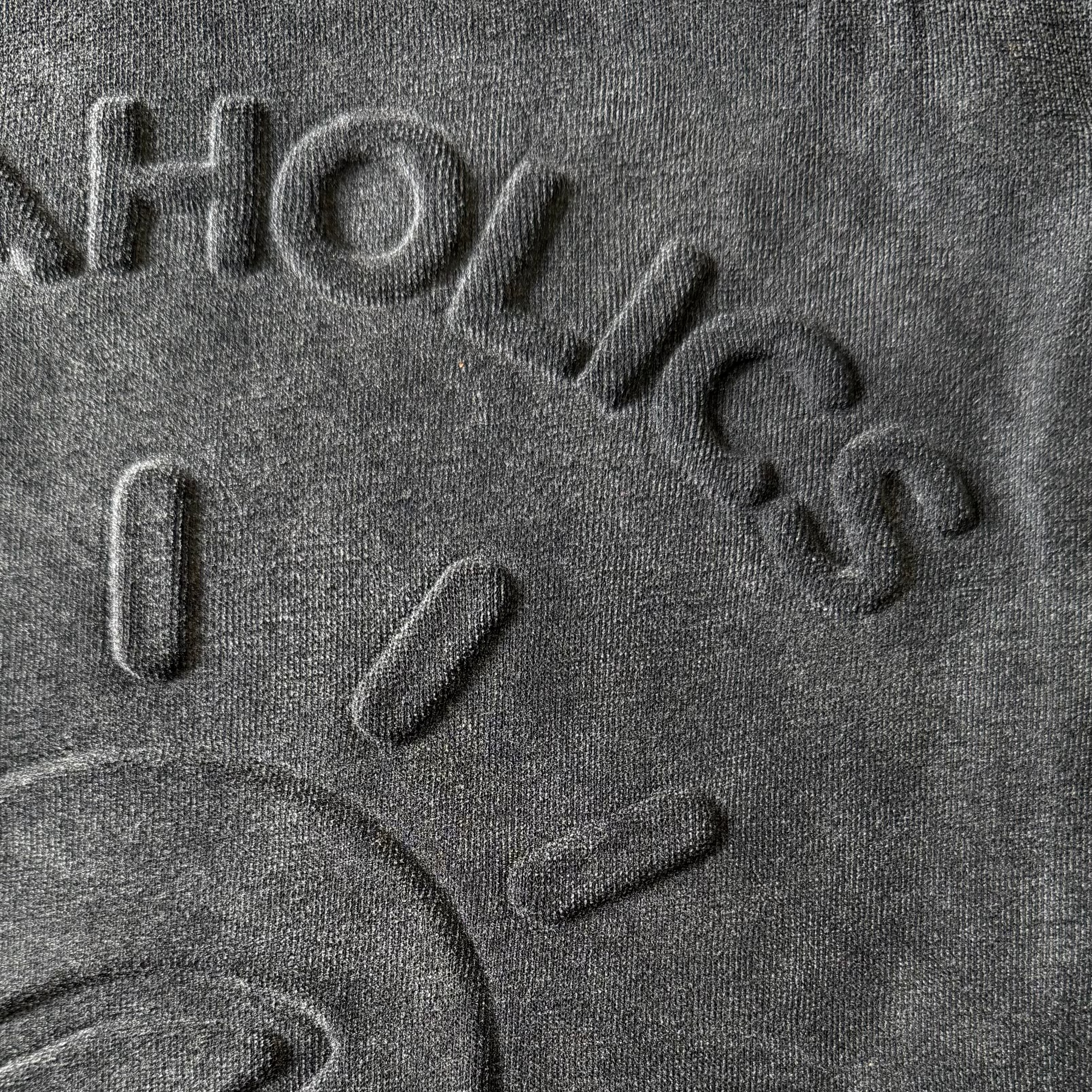 Aquaholics black hoodie embossed logo detail